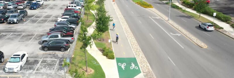 Bức tranh hoàn thiện mô tả người đi xe đạp đang chuyển động trên đường với các chi tiết và hiệu ứng động