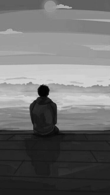 Ảnh trắng đen người đàn ông ngồi nhìn biển