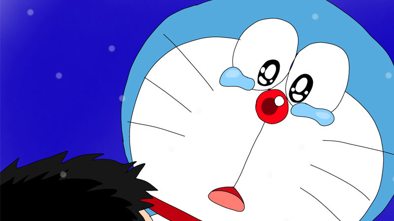 Doremon ngồi dựa vào tường hoặc một vật gì đó với vẻ mặt cô đơn, buồn bã