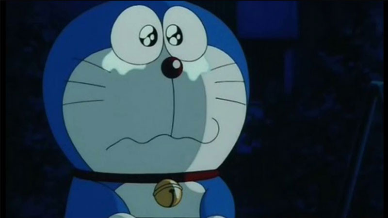 Doremon với biểu cảm buồn bã, đôi mắt có vẻ ướt át