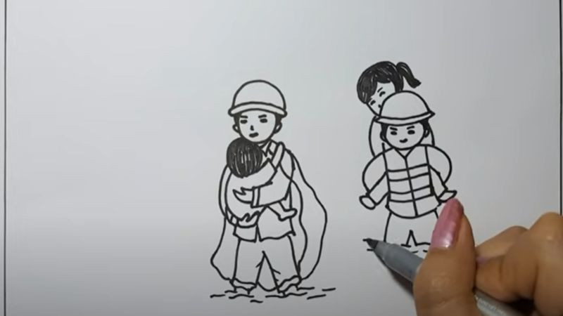 Hình ảnh chú bộ đội cõng em nhỏ vượt lũ cứu trợ