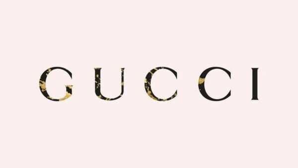 Hình nền màu xanh Gucci với họa tiết GG và ong