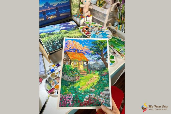 Một người đang thực hành vẽ với màu gouache, minh họa quá trình học hỏi chất liệu này