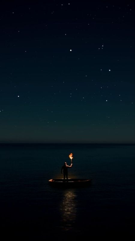 Người đàn ông nhỏ bé giữa khung trời đêm và dòng sông rộng lớn vô tận