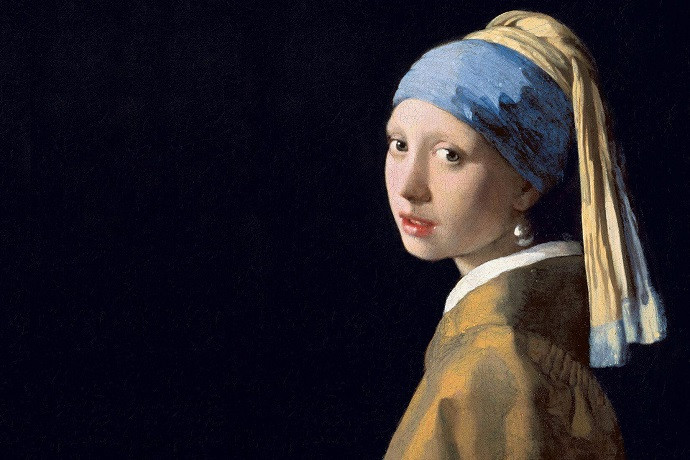 Thiếu Nữ Đeo Hoa Tai Ngọc Trai của Johannes Vermeer, bức chân dung nổi bật với chiếc hoa tai và ánh nhìn lôi cuốn trên nền tối.