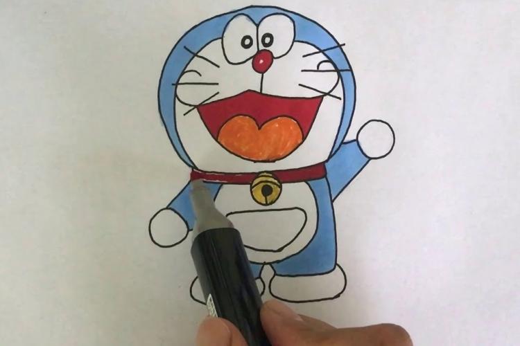 Hướng Dẫn Chi Tiết Cách Vẽ Doraemon Cực Dễ Thương Các bước phác họa đầu Doraemon tròn và khuôn mặt dễ thương với đường gióng